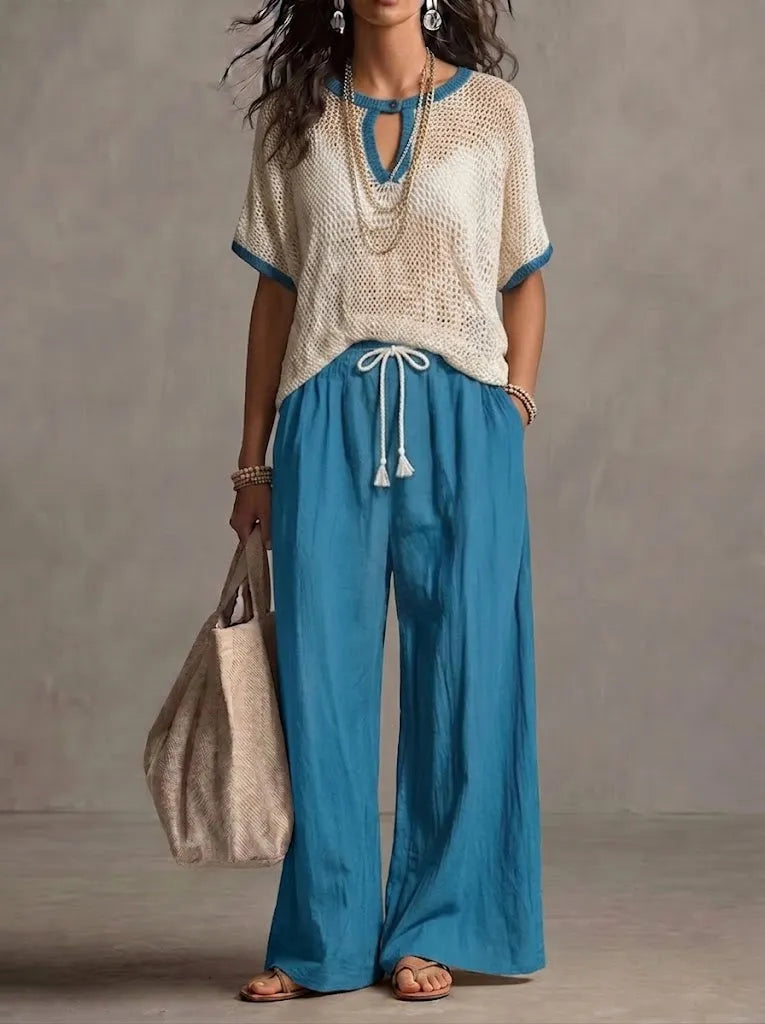 Two-piece Set Featuring A Casual Knit Cotton Top With Cut-out Details And Contrasting Color Trims, Paired With Linen-cotton Blend Trousers.